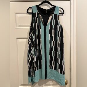 Sleeveless dress w/ cutouts around neck and chest. Southwestern, bohemian style